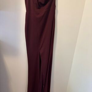 One shoulder, burgundy gown, with slit